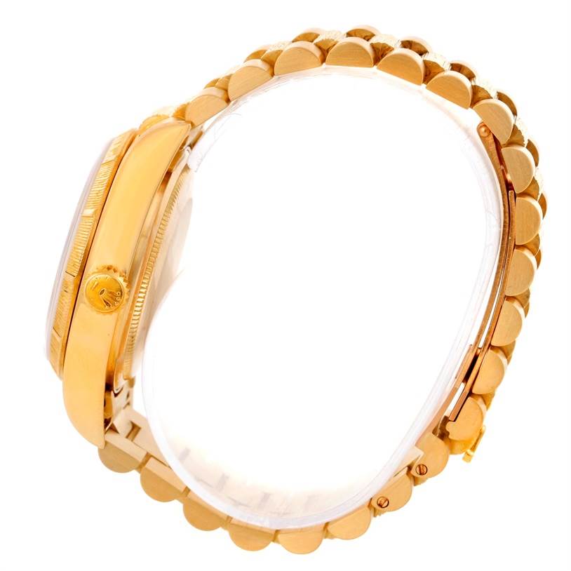 This image shows a side view of the Rolex President 18078 Men
s Yellow Gold Champagne Dial 18078 Men
s Yellow Gold Champagne Dial model, highlighting the crown, bezel, case, and bracelet.