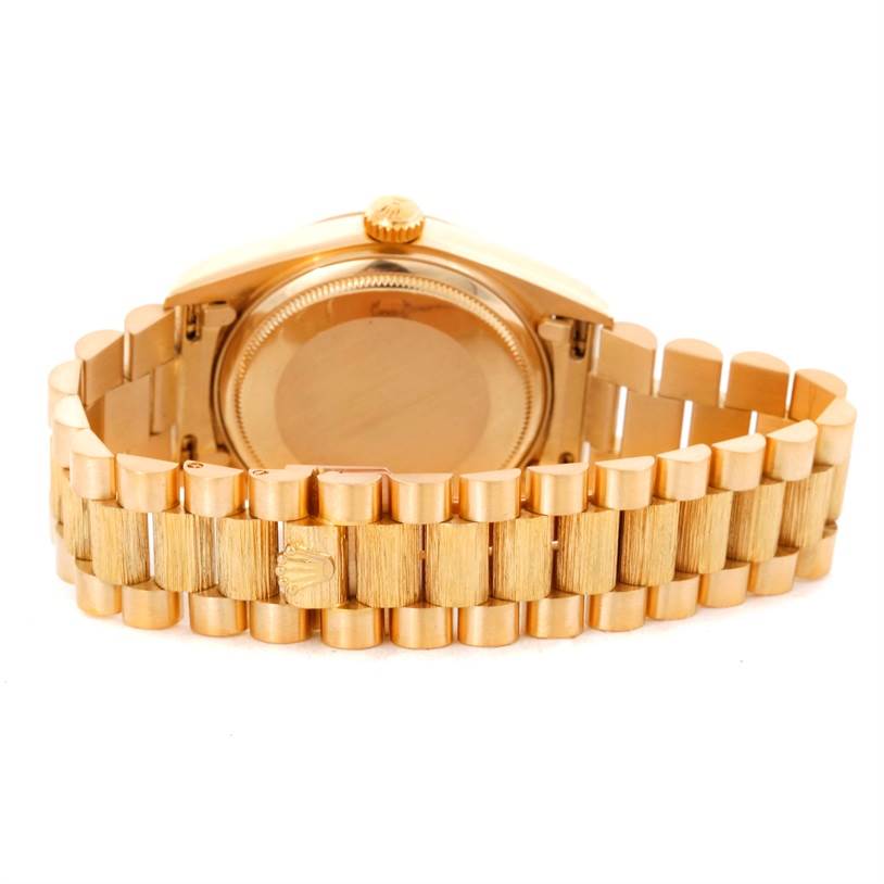 The image shows the back case and bracelet of a Rolex President 18078 Men
s Yellow Gold Champagne Dial 18078 Men
s Yellow Gold Champagne Dial model watch, viewed from behind.