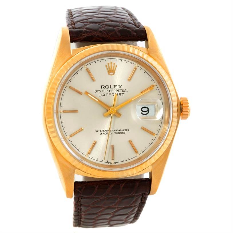 This image shows a frontal view of a Rolex President 16018 Men
s Yellow Gold Silver Dial 16018 Men
s Yellow Gold Silver Dial model with a brown leather strap and gold case, highlighting the dial and date window.