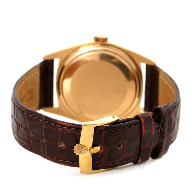 This image shows the back case and leather strap of a Rolex President 16018 Men
s Yellow Gold Silver Dial 16018 Men
s Yellow Gold Silver Dial model watch, focusing on the buckle details.