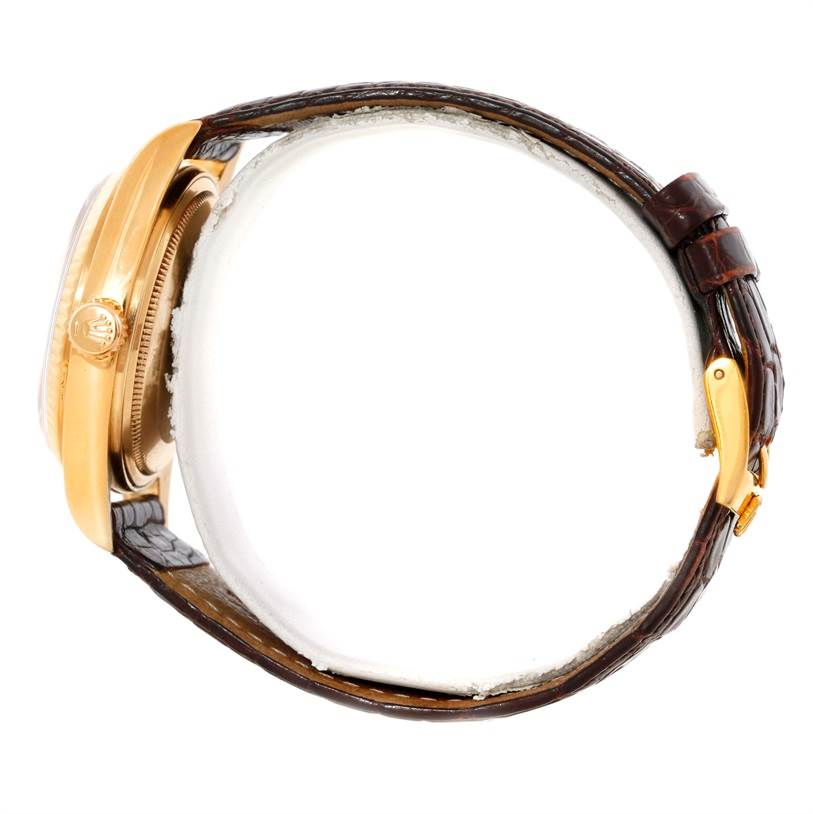 The image shows a side profile of a Rolex President 16018 Men
s Yellow Gold Silver Dial 16018 Men
s Yellow Gold Silver Dial model watch, featuring its case and leather strap.