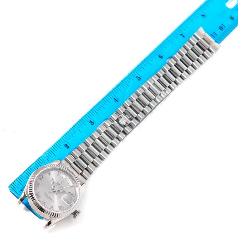 The image shows the front face and bracelet of a Rolex President 118239 Men's White Gold Grey Dial 118239 Men's White Gold Grey Dial model watch, aligned next to a blue ruler.