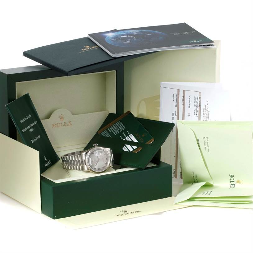 The image shows a Rolex President 118239 Men's White Gold Grey Dial 118239 Men's White Gold Grey Dial model watch at an angle displaying its face, bracelet, and original packaging along with booklets and warranty cards.