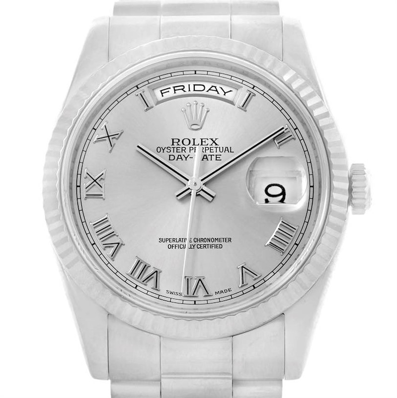 The image shows a close-up of the Rolex President model watch, highlighting the dial, hands, day-date window, and bezel.