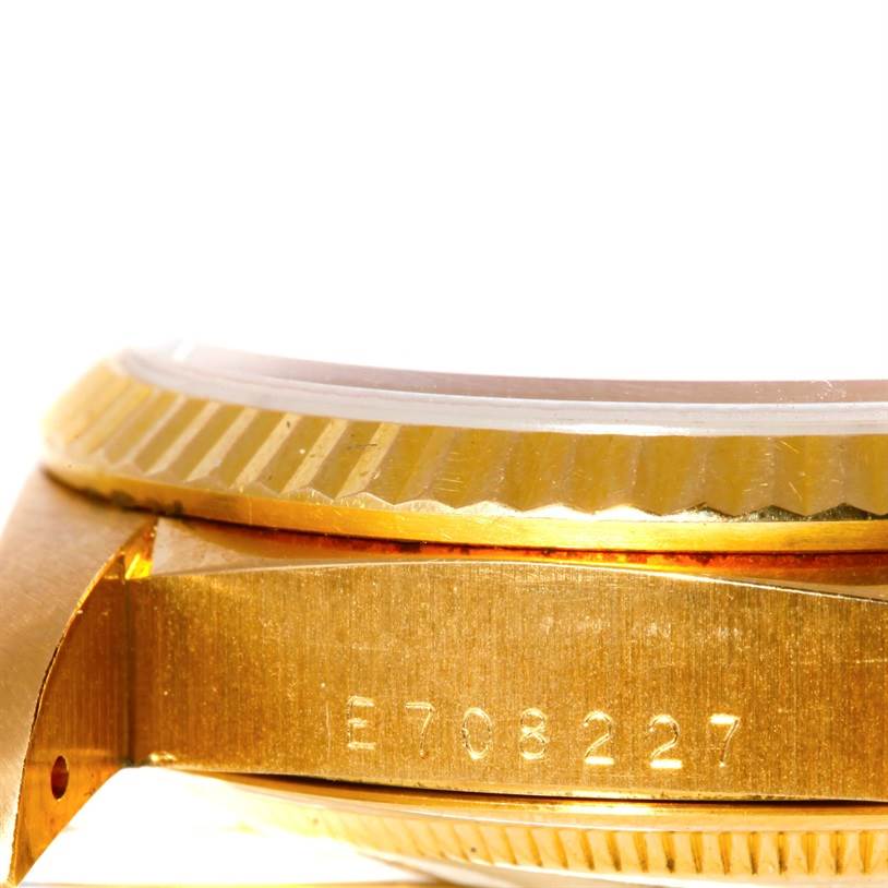 This image shows a close-up angle of the side and fluted bezel of a Rolex President 18238 Men
s Yellow Gold Champagne Dial 18238 Men
s Yellow Gold Champagne Dial model watch.