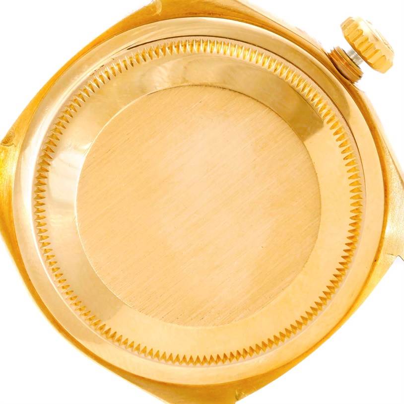 The image shows the caseback and crown of a Rolex President 18238 Men
s Yellow Gold Champagne Dial 18238 Men
s Yellow Gold Champagne Dial model watch from a close-up, top-down angle.