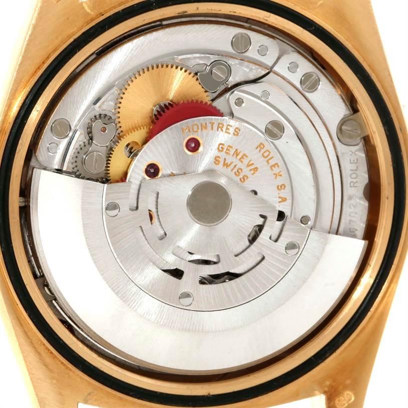 The image shows the inner mechanics and movement of a Rolex President 18238 Men
s Yellow Gold Champagne Dial 18238 Men
s Yellow Gold Champagne Dial model watch from a close-up, rear angle.