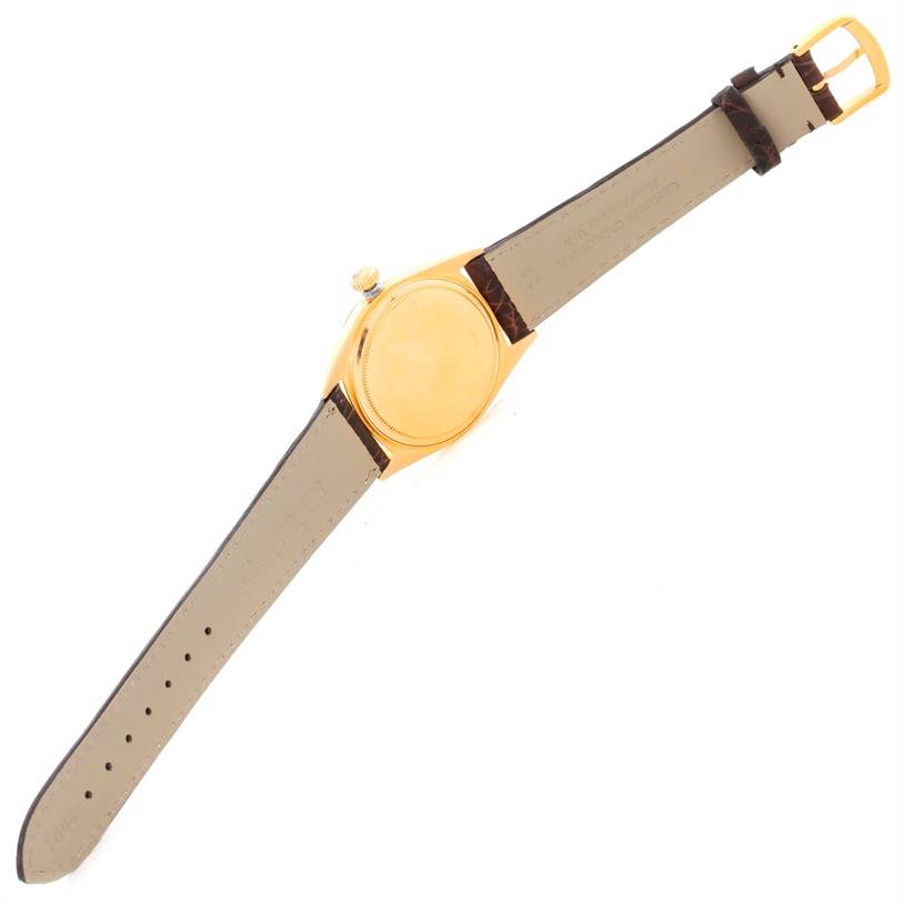 This image shows the back and sides of a Rolex President 1803 Men
s Yellow Gold Silver Dial 1803 Men
s Yellow Gold Silver Dial model watch, including the strap and buckle.