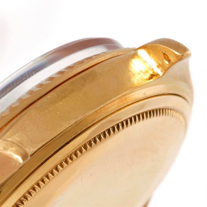 This close-up shows the side and part of the bezel of a Rolex President 1803 Men
s Yellow Gold Silver Dial 1803 Men
s Yellow Gold Silver Dial model watch.
