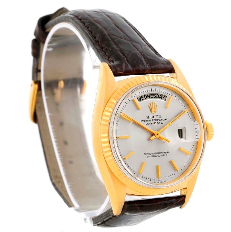 The Rolex President 1803 Men
s Yellow Gold Silver Dial 1803 Men
s Yellow Gold Silver Dial model watch is shown at a slight angle, capturing the dial, bezel, crown, and part of the leather strap.