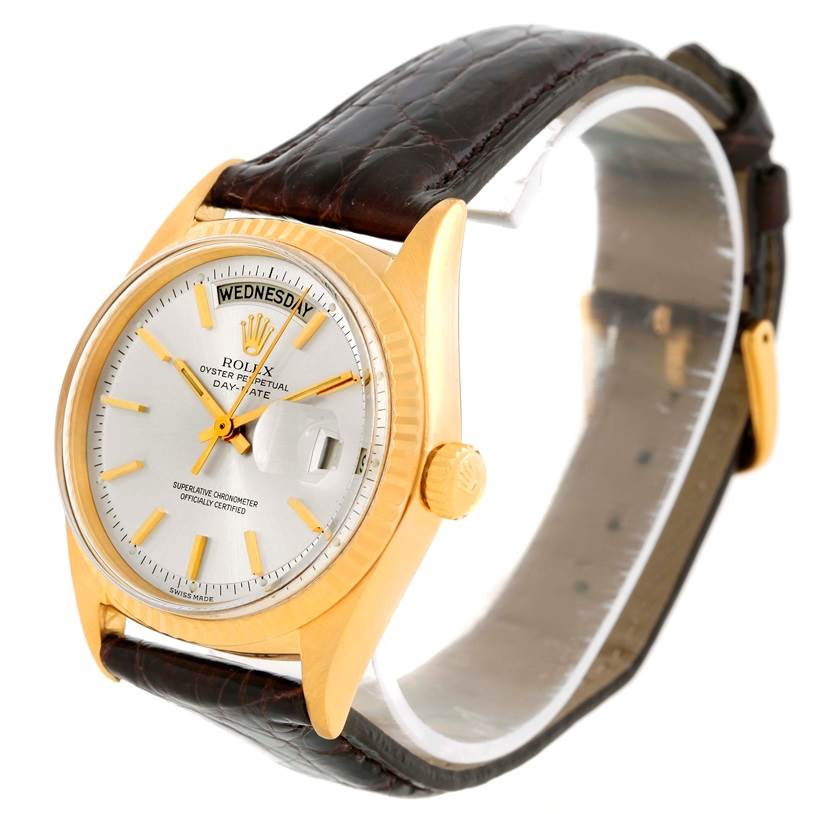The image shows a Rolex President 1803 Men
s Yellow Gold Silver Dial 1803 Men
s Yellow Gold Silver Dial model watch at an oblique angle, highlighting the face, crown, and leather strap.