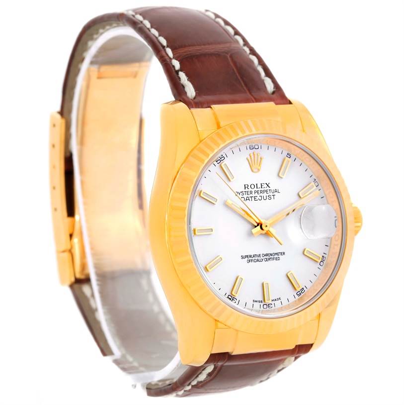 The image shows a Rolex Datejust watch, President model, from an oblique angle highlighting its face, bezel, case, and leather strap.