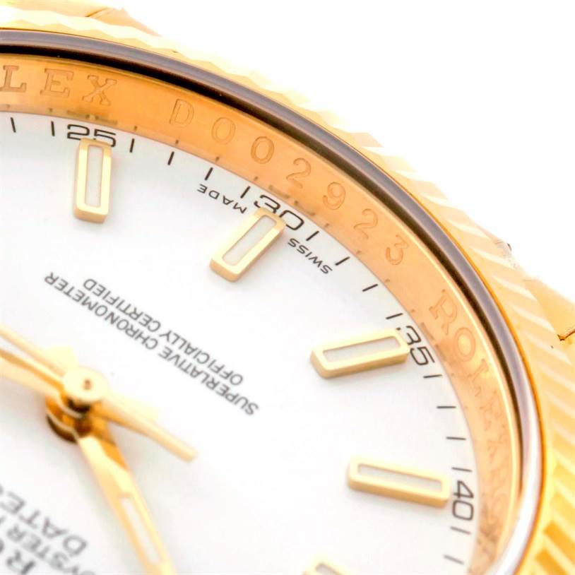 This close-up image shows the dial and part of the case of a Rolex President 116138 Men's Yellow Gold White Dial 116138 Men's Yellow Gold White Dial model watch.