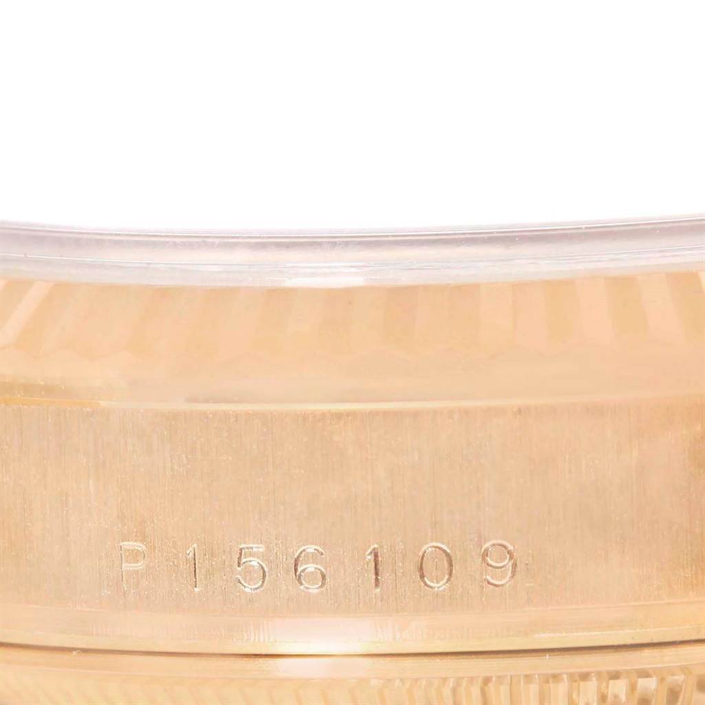 The image shows a close-up angle of the serial number engraved on the case side of a Rolex President 118235 Men's Rose Gold White Dial 118235 Men's Rose Gold White Dial watch.
