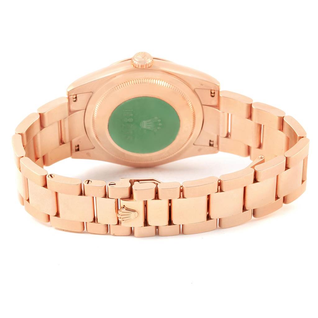 This image shows the back and band of a Rolex President 118235 Men's Rose Gold White Dial 118235 Men's Rose Gold White Dial model watch from a rear view angle.