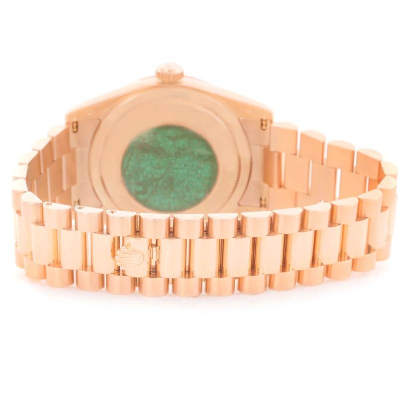 The image shows the back view of a Rolex President 118205 Men's Rose Gold Black Dial 118205 Men's Rose Gold Black Dial model, focusing on the bracelet and case back.