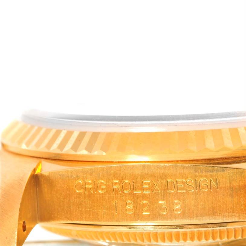 This close-up image shows the side profile of the bezel and case of a Rolex President 18238 Men
s Yellow Gold Champagne Dial 18238 Men
s Yellow Gold Champagne Dial model 18238.