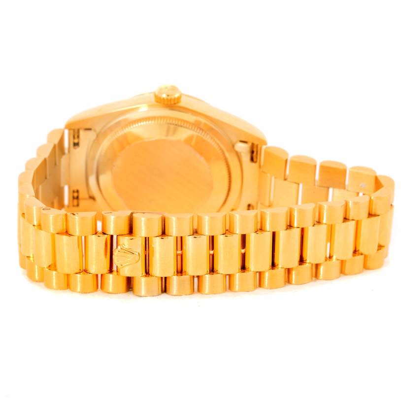 This image shows the back and bracelet of a Rolex President 18238 Men
s Yellow Gold Champagne Dial 18238 Men
s Yellow Gold Champagne Dial model watch, with a focus on the gold links.