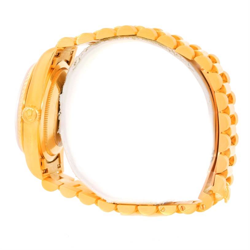 This image shows a side view of the Rolex President 18238 Men
s Yellow Gold Champagne Dial 18238 Men
s Yellow Gold Champagne Dial model watch, focusing on the bracelet and case.