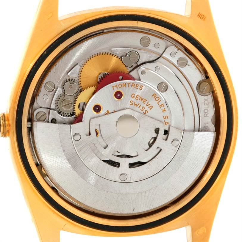 This image shows the inner mechanical components and movement of the Rolex President 18238 Men
s Yellow Gold Champagne Dial 18238 Men
s Yellow Gold Champagne Dial watch from a back angle.