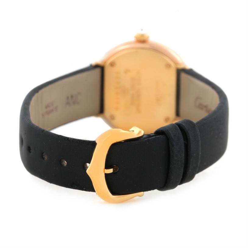 The image shows a rear view angle of a Cartier Trinity W200246 Women's Yellow Gold Beige Dial W200246 Women's Yellow Gold Beige Dial model watch, highlighting its black strap and gold buckle.