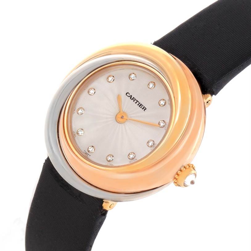 The image shows a close-up, angled view of a Cartier Trinity W200246 Women's Yellow Gold Beige Dial W200246 Women's Yellow Gold Beige Dial watch, highlighting the dial, bezel, and part of the black strap.