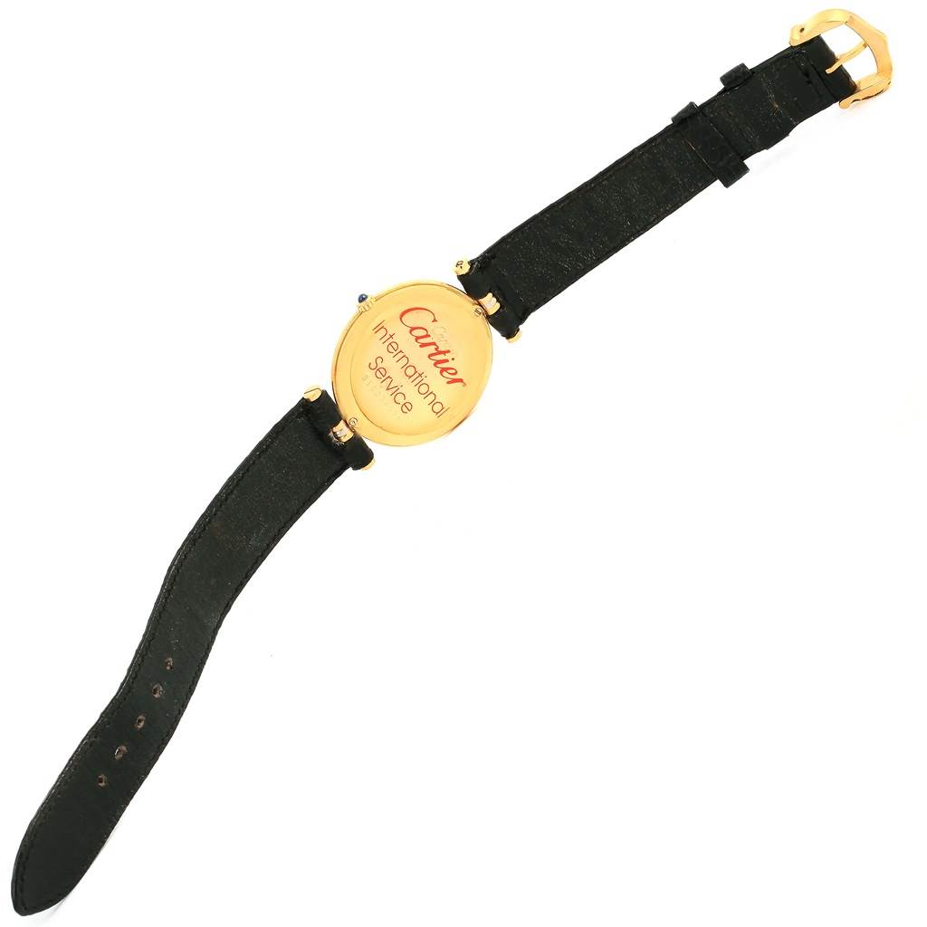 This image shows the back of the Cartier Trinity W1514457 Yellow Gold White Dial W1514457 Yellow Gold White Dial model watch, including the leather strap and gold clasp.