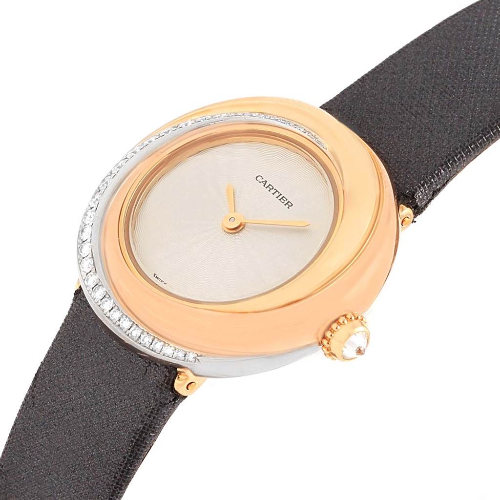 This image shows the Cartier Trinity WG200151 Women's Yellow Gold Beige Dial WG200151 Women's Yellow Gold Beige Dial model watch from an angled side view, highlighting the face, bezel, hands, and crown.