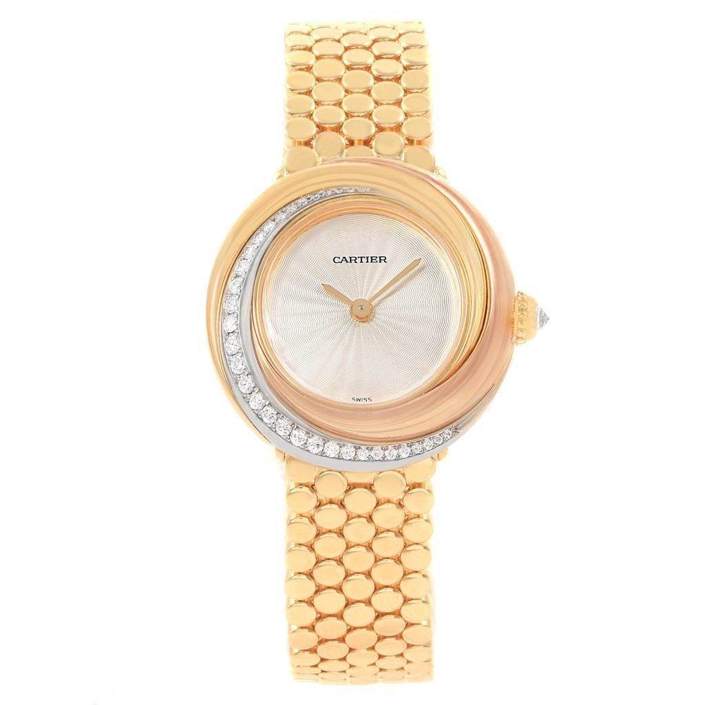 The image shows a front view of the Cartier Trinity WG200258 Women's Yellow Gold Beige Dial WG200258 Women's Yellow Gold Beige Dial model watch, highlighting its gold bracelet and diamond-accented bezel.