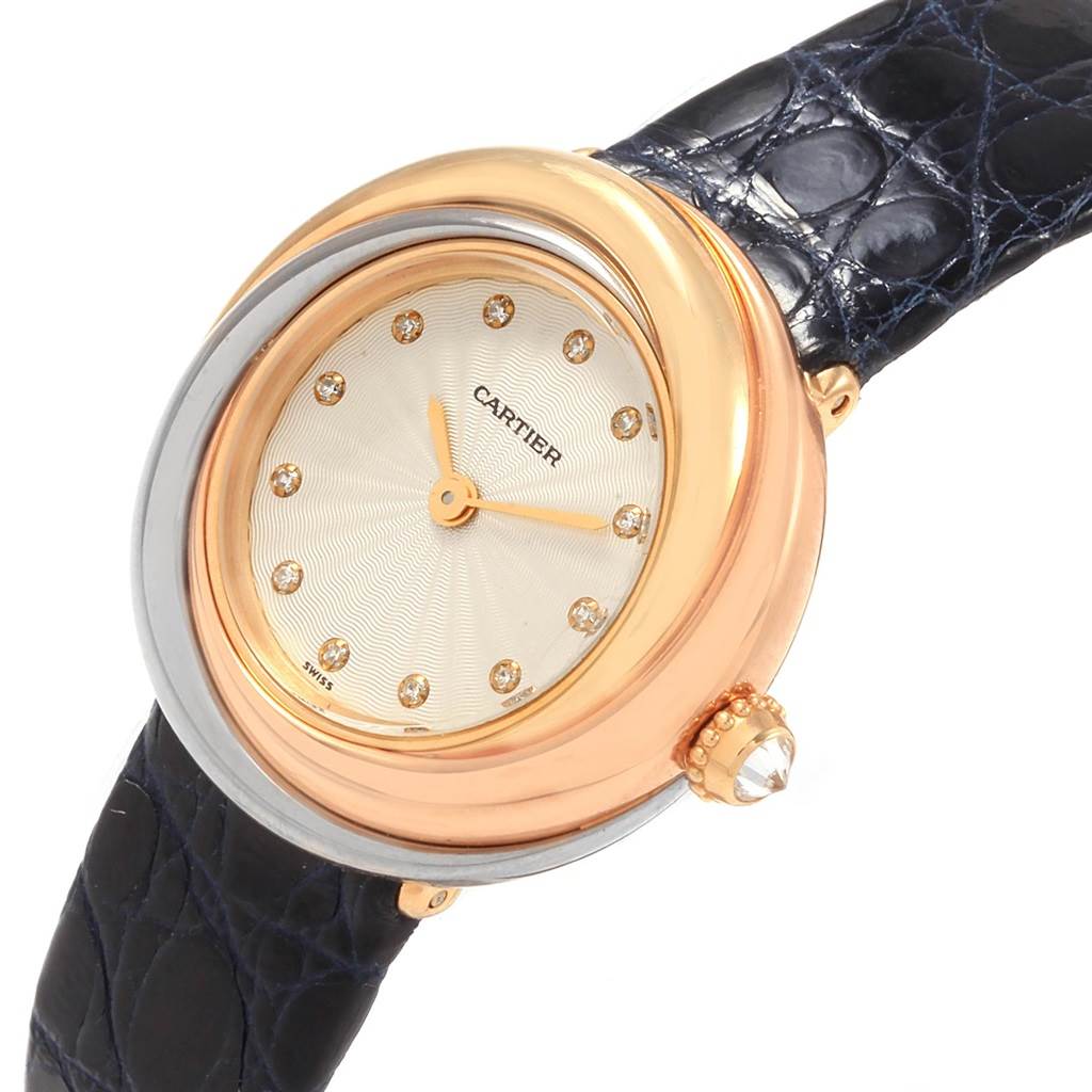 The Cartier Trinity W200246 Women
s Yellow Gold Beige Dial W200246 Women
s Yellow Gold Beige Dial model watch is shown at an angle, highlighting its face, bezel, crown, and leather strap.