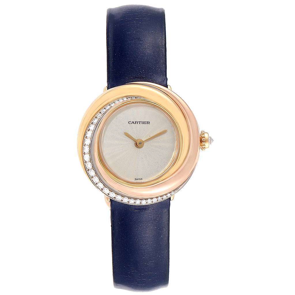 The image shows a frontal view of a Cartier Trinity WG200151 Women's Yellow Gold Beige Dial WG200151 Women's Yellow Gold Beige Dial model watch with a blue leather strap and diamond-accented bezel.