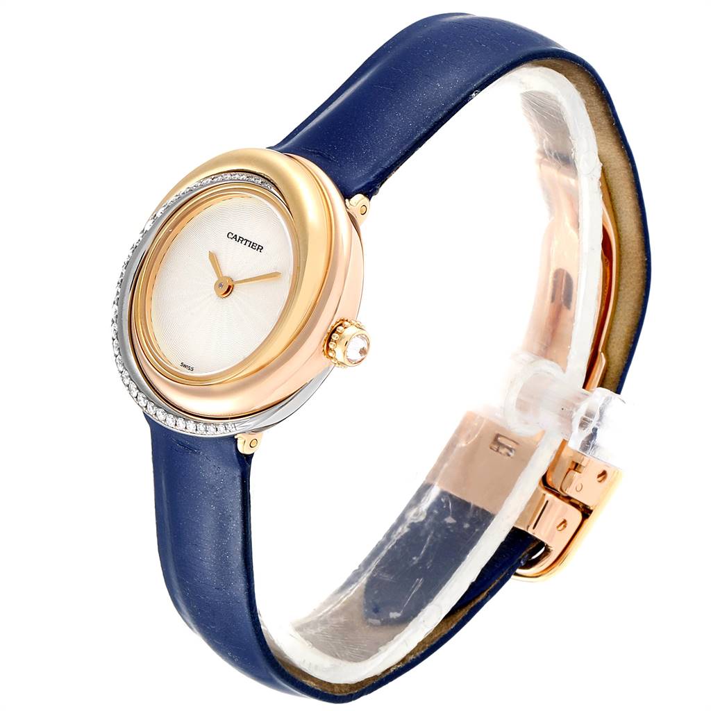 The Cartier Trinity WG200151 Women's Yellow Gold Beige Dial WG200151 Women's Yellow Gold Beige Dial model watch is shown at an angle displaying its dial, case, crown, and blue leather strap with buckle.