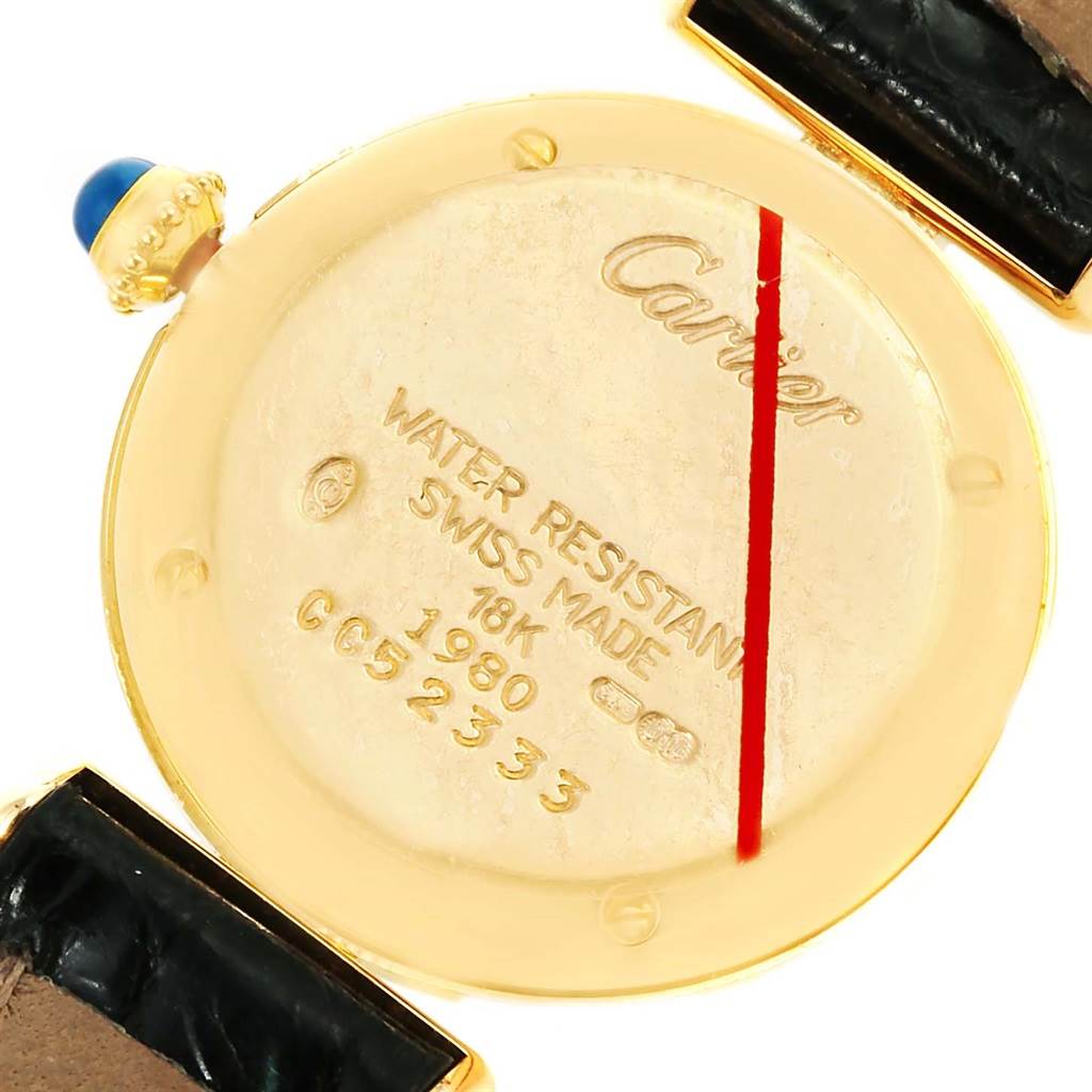 The image shows the back case of a Cartier Colisee Women's Yellow Gold Silver Dial Women's Yellow Gold Silver Dial model watch, highlighting details like water resistance and the 18K gold material.