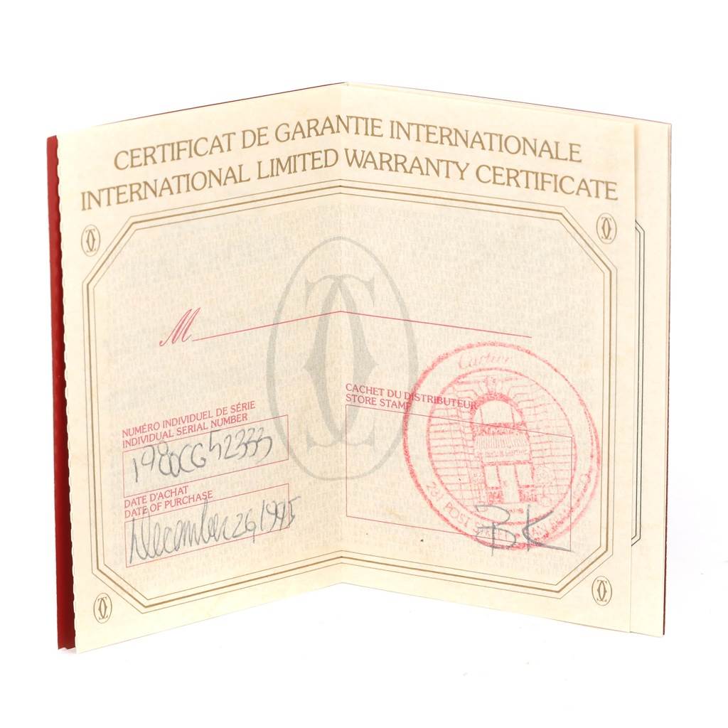 The image shows an International Limited Warranty Certificate for the Cartier Colisee Women's Yellow Gold Silver Dial Women's Yellow Gold Silver Dial model, featuring handwritten details and a store stamp.