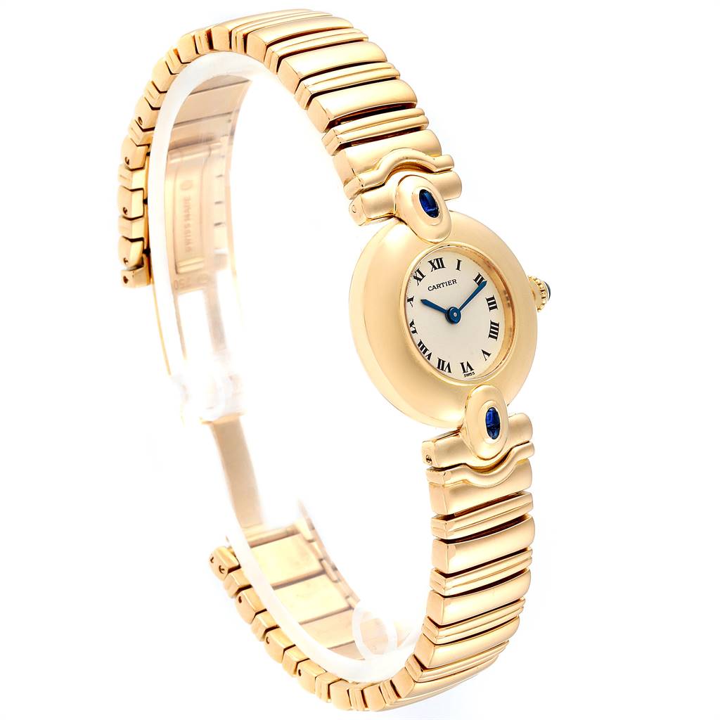 The image shows a side angle of a Colisee model watch by Cartier, highlighting its gold bracelet and round face with Roman numerals.