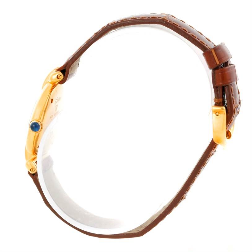 This image shows a Colisee model by Cartier from the side, displaying the case, crown, and brown leather strap.