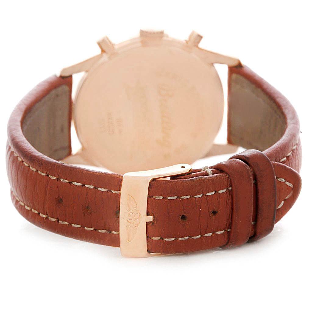 The image shows the rear view of a Breitling Premier H42035 Men's Rose Gold Silver Dial H42035 Men's Rose Gold Silver Dial watch, highlighting the leather strap and gold buckle.