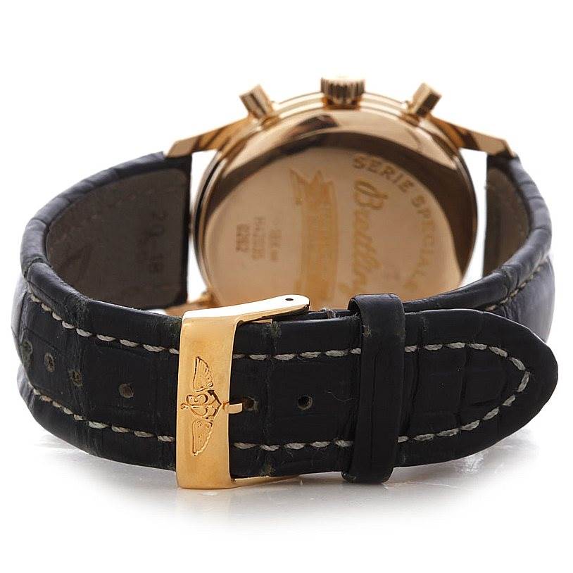 This image shows the rear view of the Breitling Premier H42035 Men's Rose Gold Black Dial H42035 Men's Rose Gold Black Dial model watch, showcasing its back case and leather strap with a clasp.