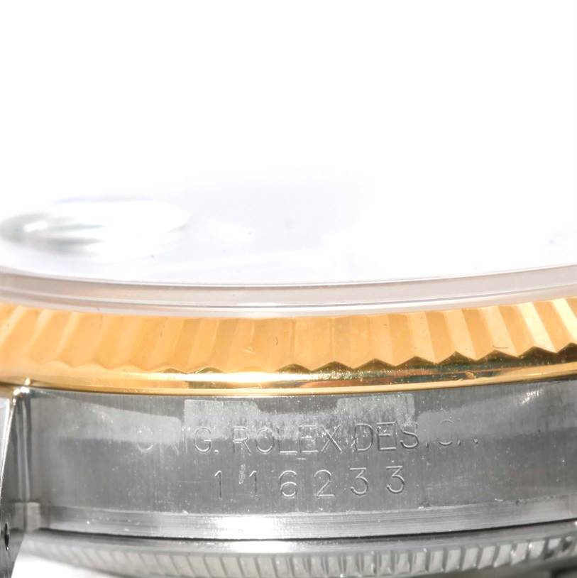 The image shows a close-up side view of the bezel and case of a Rolex Datejust 116233 Men's Stainless Steel Blue Dial 116233 Men's Stainless Steel Blue Dial watch.