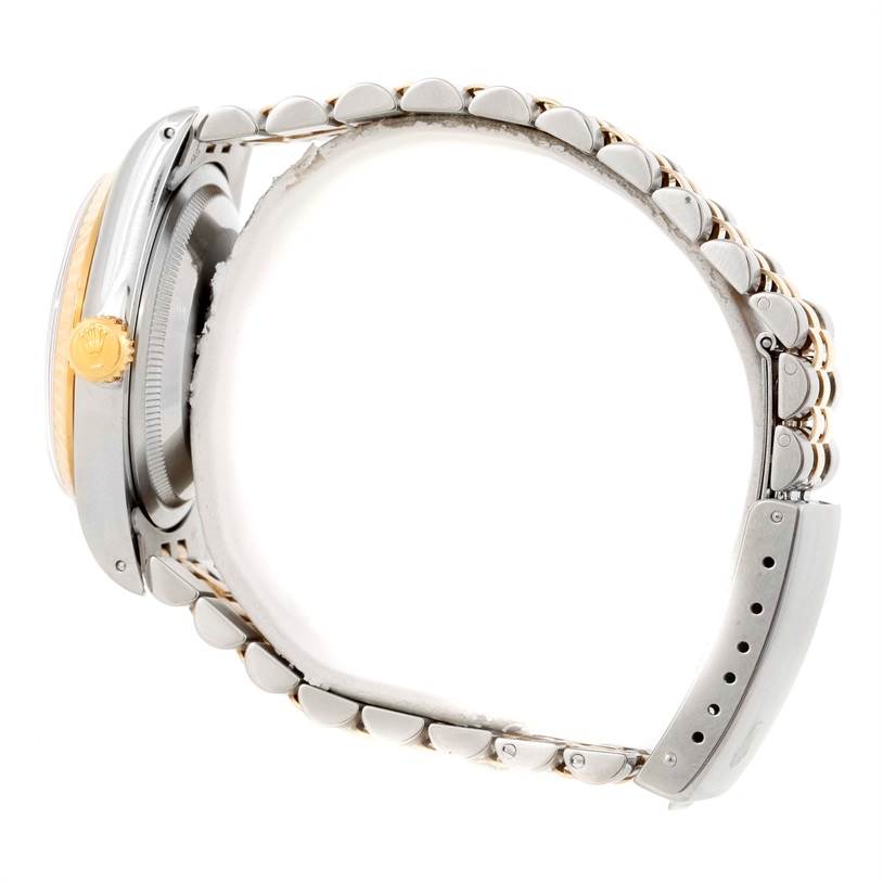 The image shows a side view of a Rolex Datejust 16233 Men's Steel and Gold (two tone) Black Dial 16233 Men's Steel and Gold (two tone) Black Dial watch, focusing on its crown, case, and bracelet.