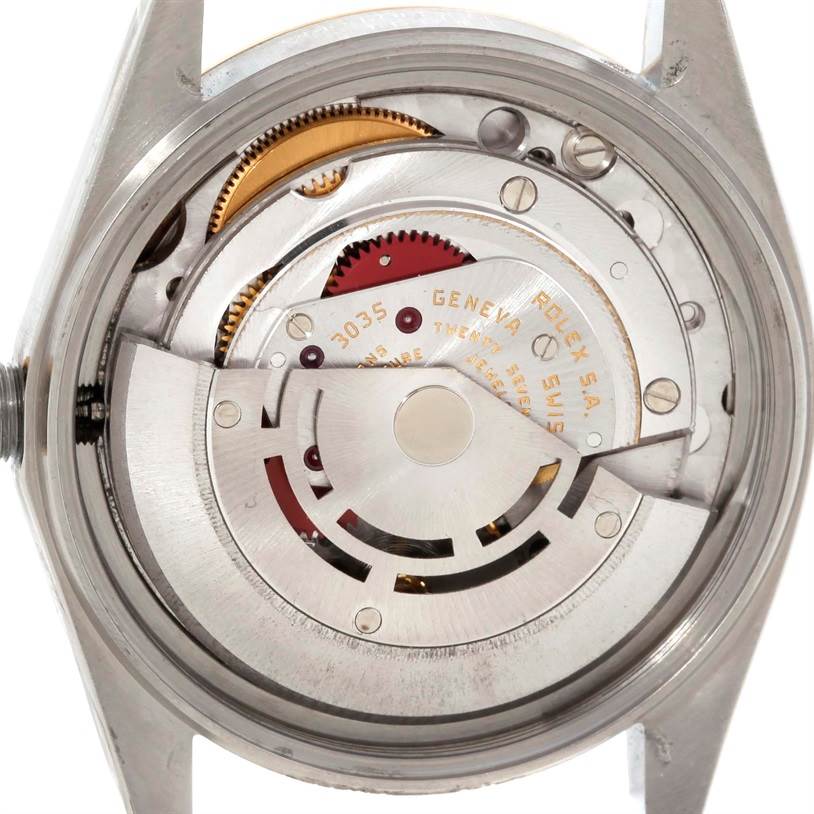 The image shows the internal movement of a Rolex Datejust 16013 Men's Stainless Steel Champagne Dial 16013 Men's Stainless Steel Champagne Dial watch from a back angle, revealing gears and mechanical components.