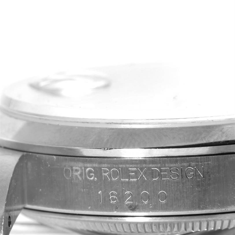 The image shows a close-up of the side of a Rolex Datejust 16200 Men
s Stainless Steel Pink Dial 16200 Men
s Stainless Steel Pink Dial model 16200, focusing on the case and its engraving.