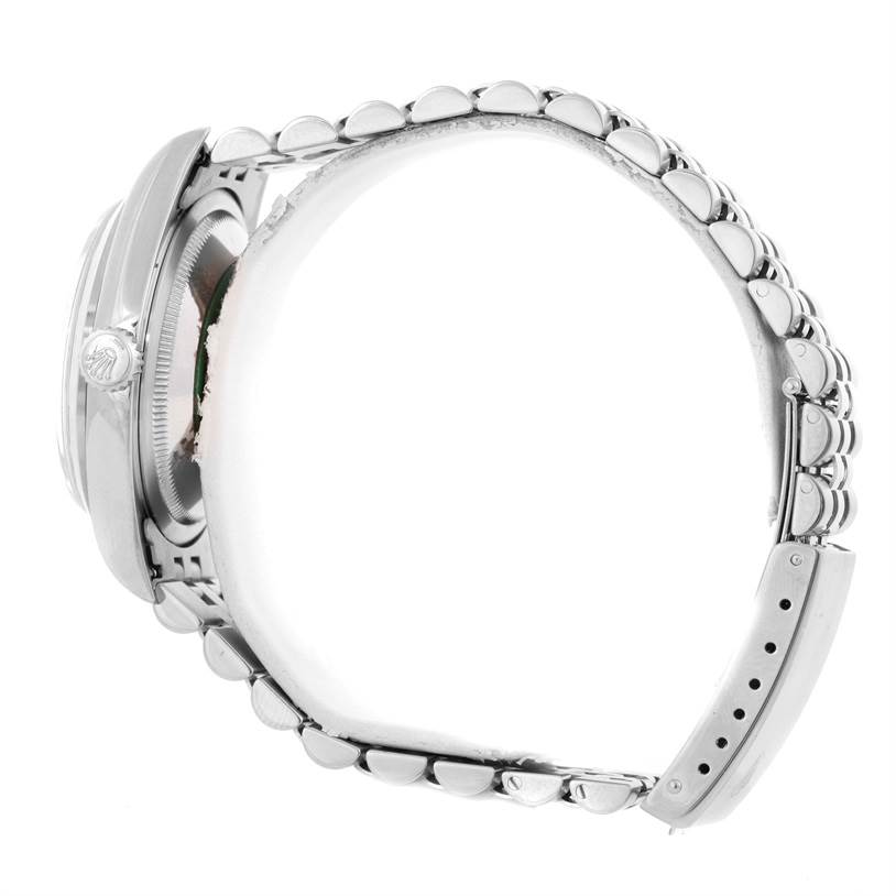 The image shows a side view of the Rolex Datejust 16200 Men
s Stainless Steel Pink Dial 16200 Men
s Stainless Steel Pink Dial watch, highlighting its case, crown, and bracelet.