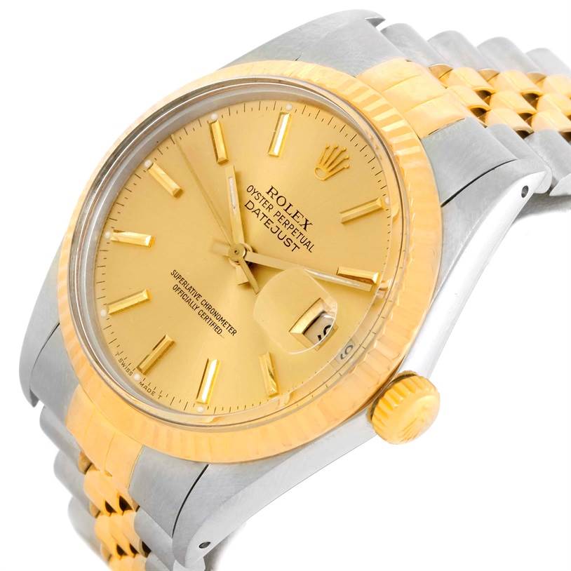 The Rolex Datejust 16013 Men's Stainless Steel Champagne Dial 16013 Men's Stainless Steel Champagne Dial watch is shown at a slight angle, highlighting its yellow gold bezel, champagne dial, and two-tone bracelet.