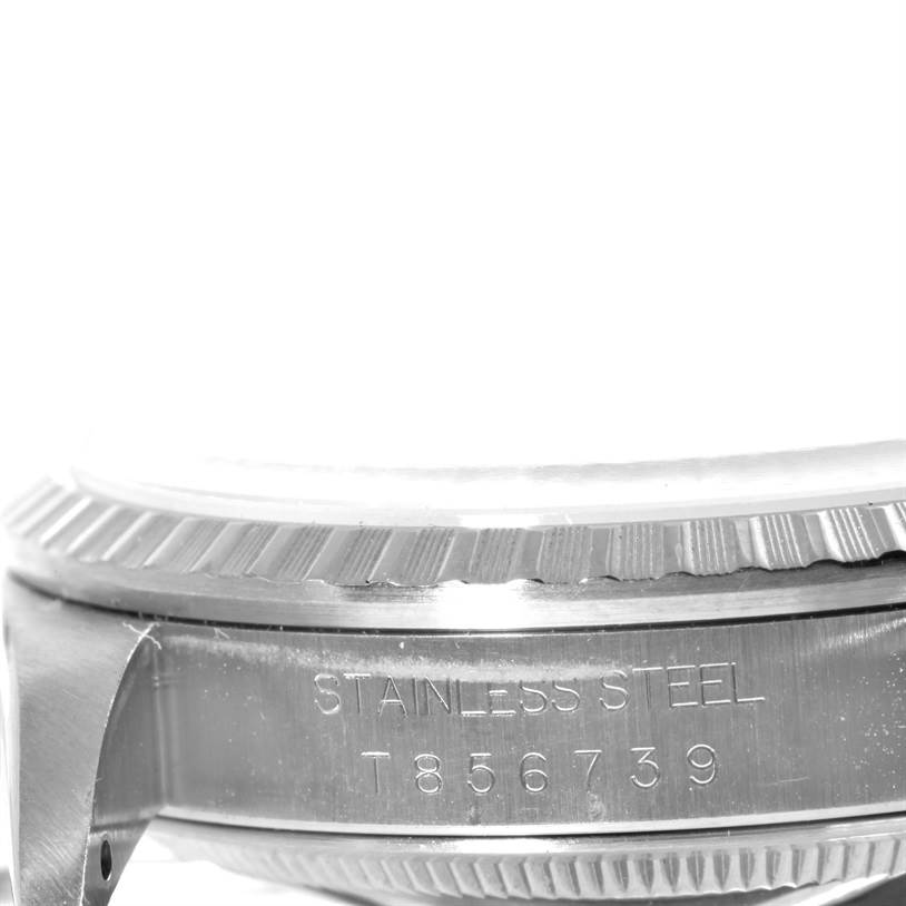The image shows a close-up side angle of the stainless steel case and fluted bezel of a Rolex Datejust 16220 Men's Stainless Steel Silver Dial 16220 Men's Stainless Steel Silver Dial watch.