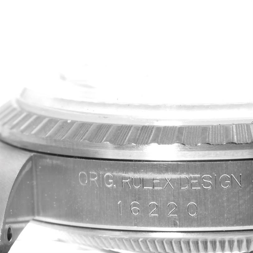 The image shows the side view of a Rolex Datejust 16220 Men's Stainless Steel Silver Dial 16220 Men's Stainless Steel Silver Dial with model number 16220 engraved on the case.