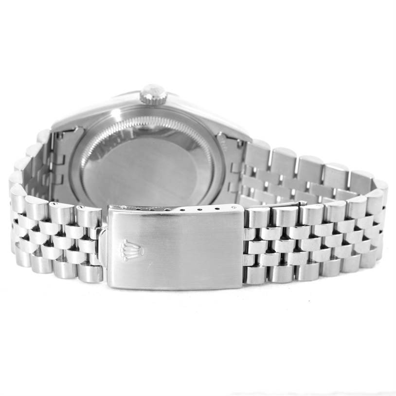 This image shows the back view of a Rolex Datejust 16220 Men's Stainless Steel Silver Dial 16220 Men's Stainless Steel Silver Dial watch, highlighting its case, crown, and Jubilee bracelet with clasp.