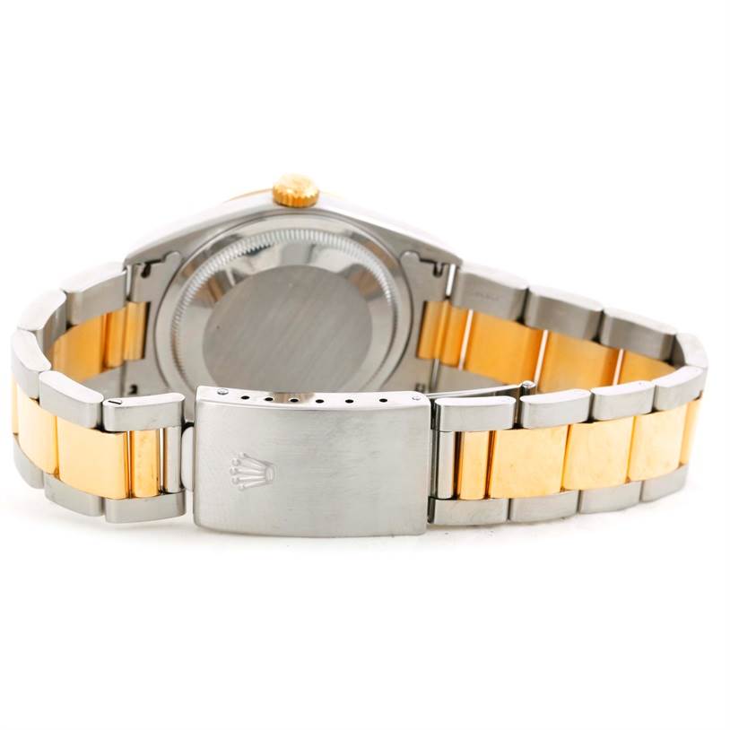 The image shows the back view of a Rolex Datejust 16233 Men's Steel and Gold (two tone) Champagne Dial 16233 Men's Steel and Gold (two tone) Champagne Dial watch, focusing on its clasp and bracelet.