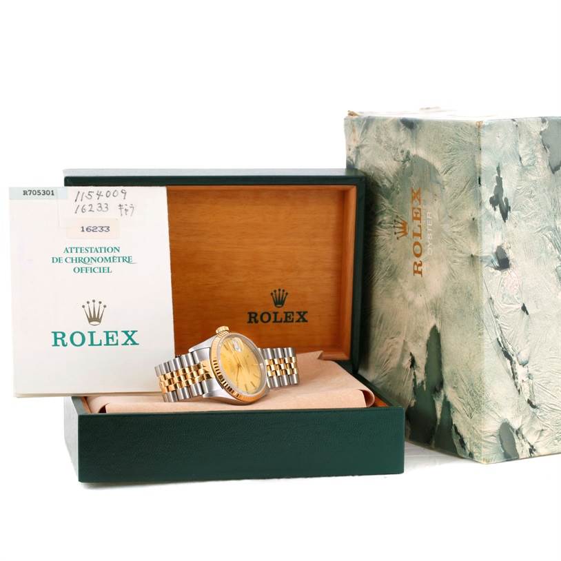 The image shows a Rolex Datejust 16233 Men's Steel and Gold (two tone) Champagne Dial 16233 Men's Steel and Gold (two tone) Champagne Dial watch displayed in its box, with accompanying certification paperwork and outer packaging also visible.