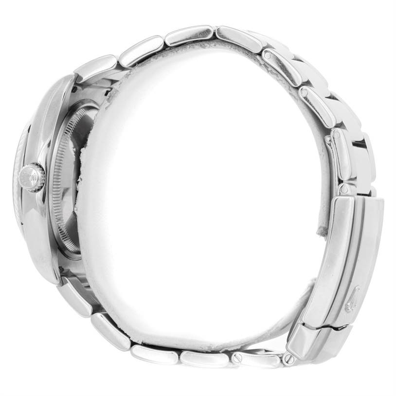 This side view of the Rolex Datejust 115234 Men
s Stainless Steel Black Dial 115234 Men
s Stainless Steel Black Dial watch shows the bracelet and case with the crown visible on the left side.